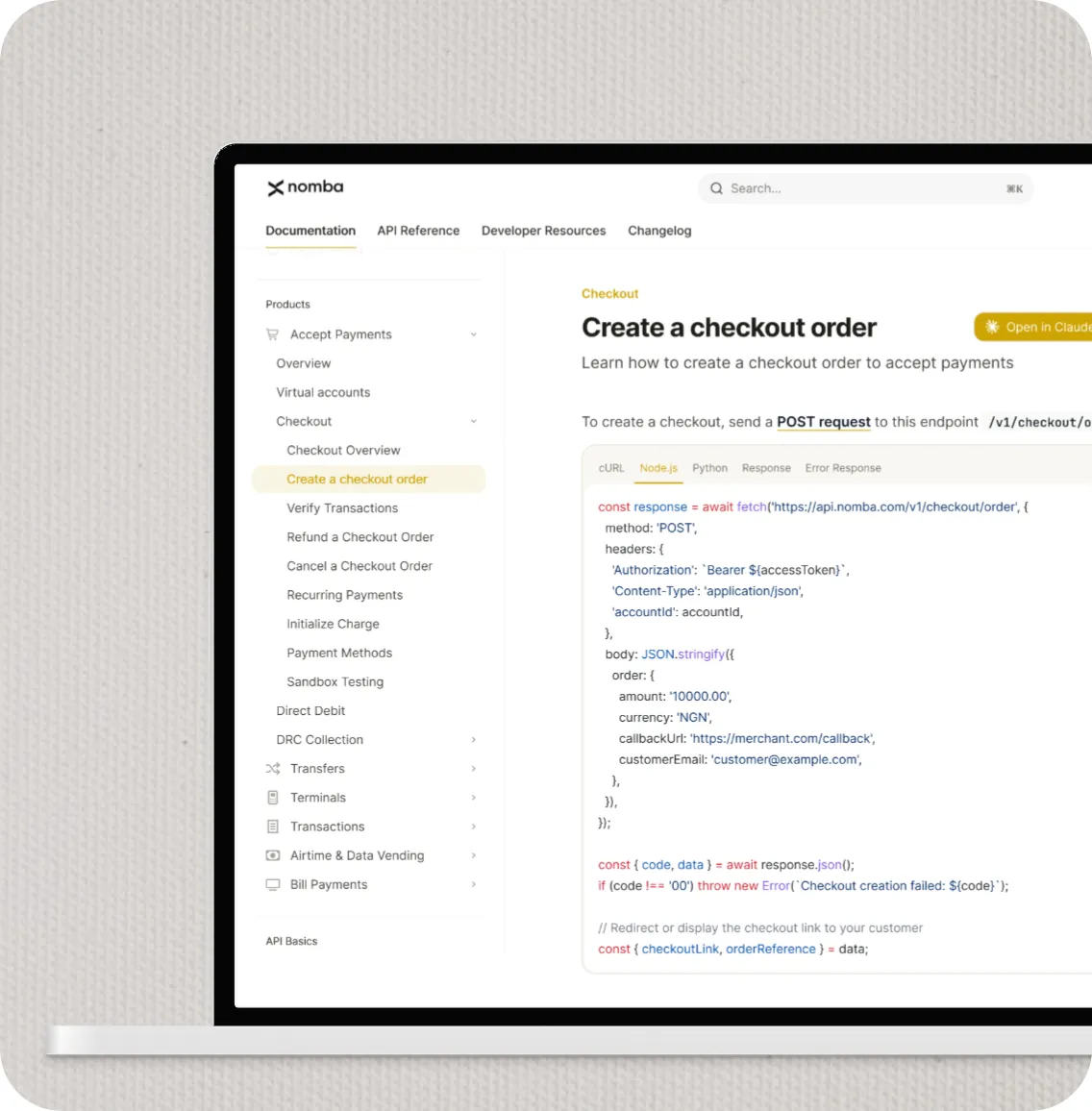Nomba developer documentation shown on a laptop